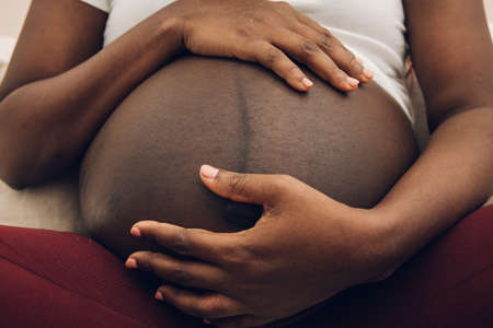 pregnant belly of a black womanの写真素材
