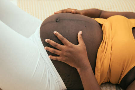 pregnant belly of a black womanの写真素材