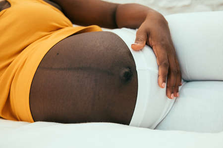 pregnant belly of a black womanの写真素材