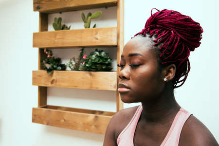 black woman portrait doing meditationの写真素材