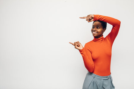 black woman person wearing a red shirt on a white backgroundの写真素材
