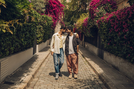 young handsome hipster gay couple in european style clothes outdoorの写真素材