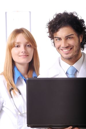 young doctors use laptop and look in camera, on the white background
