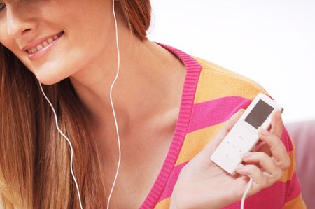 woman listen to the music; smiling and relaxの写真素材