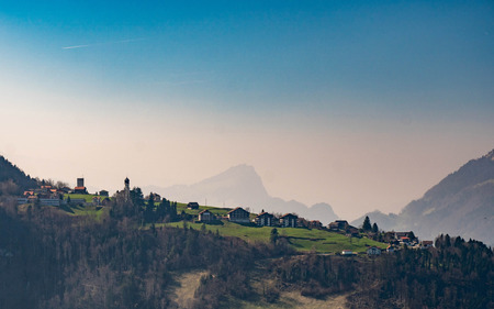 small village on a hill, blue sky
