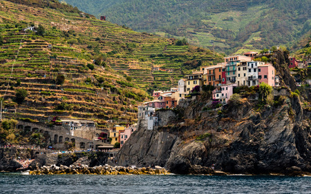 little village on steep hill in italy coastの写真素材