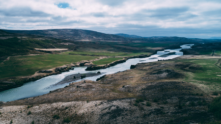 aerial view of river in iceland with light blue waterの写真素材