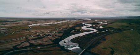 aerial view of river with many junctions and highwayの写真素材