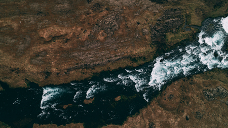 top down aerial hsot of river in icelandの写真素材