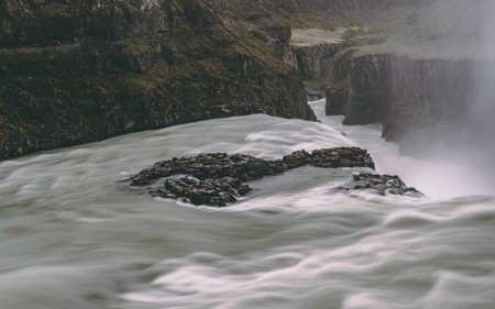 gulfoss waterfall in iceland with smooth water long time exposure rockyの素材 [FY310103842532]