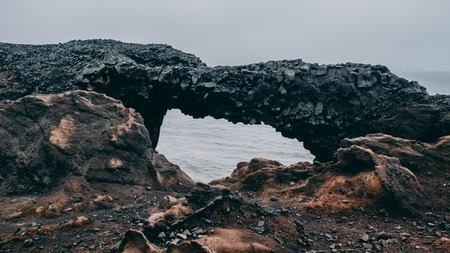black basalt rock bridge in iceland. hexagon stone bridge in vik, black stoneの写真素材