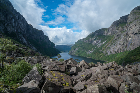 massive fjord in norway with stones infront geirangerの写真素材
