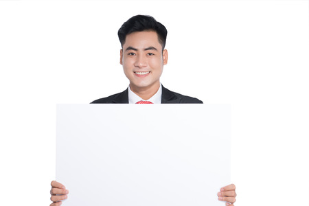 Happy young man showing and displaying placardの写真素材