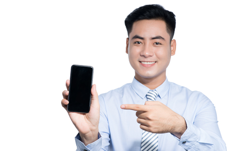 Asian man show his smart phone on white backgroundの写真素材