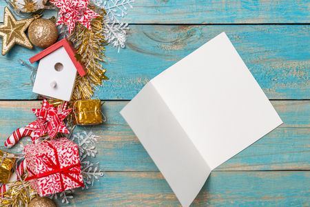 Christmas background with decorations with greeting cards on wooden background. Top view with copy spaceの写真素材