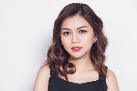 Beautiful stylish asian woman in elegant casual black outfit posingの写真素材