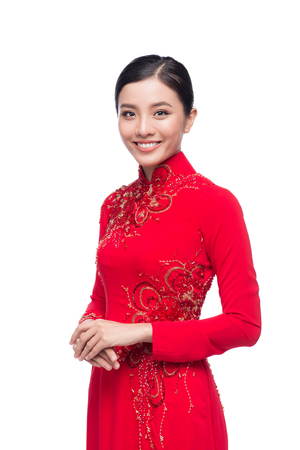 Charming Vietnamese Woman in Ao Dai Traditional Dress isolated on white.の写真素材
