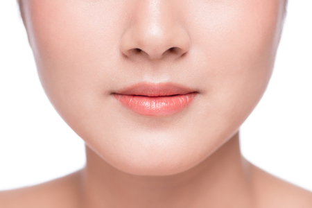 Young asian woman close up. Perfect natural lip makeupの写真素材