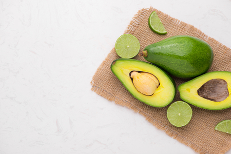 Healthy food concept. Fresh organic avocado on tableの写真素材