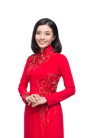 Charming Vietnamese Woman in Ao Dai Traditional Dress isolated on white.の写真素材