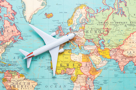 Travel. Trip. Vacation - Top view airplane with touristic mapの写真素材