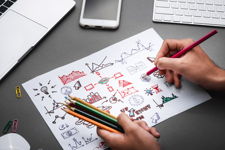 Business concept. Businessman writing idea sketch