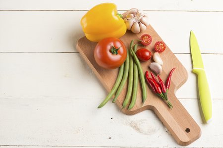 Organic food background vegetables on the cutting board.の写真素材