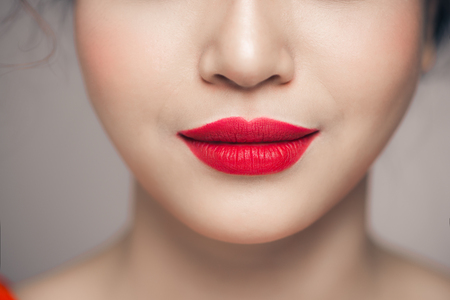 Beautiful Perfect Lips. Beauty young asian woman Lips over white backgroundの写真素材