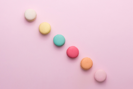 Colorful pastel cake macaron or macaroon on pink background from aboveの写真素材