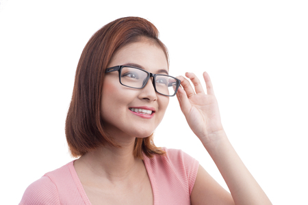 Portrait of a young cheerful asian woman in glassesの写真素材