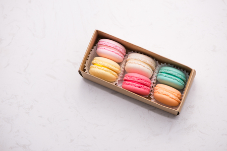 Sweet macarons. Different french cookies macaroons in a paper box.の写真素材