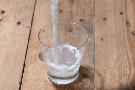 Milk. Image of Milk fall into glass.の写真素材