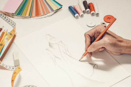 Close-up of designer drawing a fashion sketchの写真素材