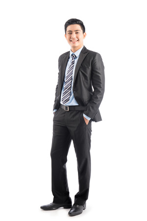 Full length of handsome asian businessman isolated on white backgroundの写真素材