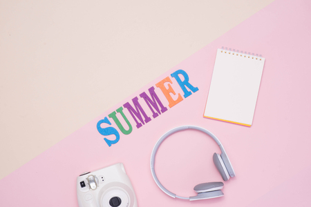 Summer fun written in colorful wooden letters on pastel color background.の写真素材