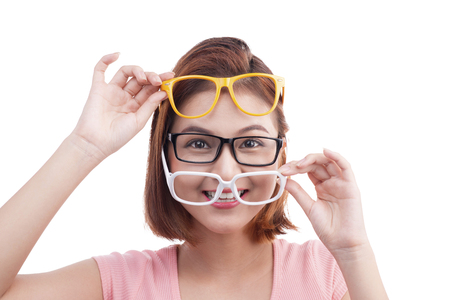 Closeup portrait of a young cheerful asian woman in glassesの写真素材