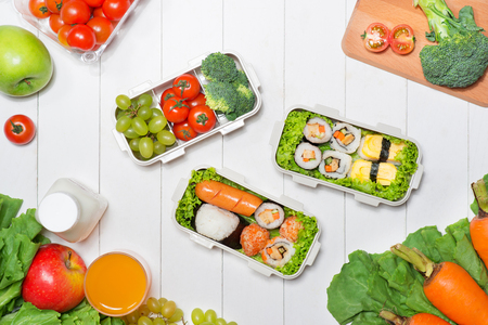 Bento box with different food, fresh veggies and fruitsの写真素材
