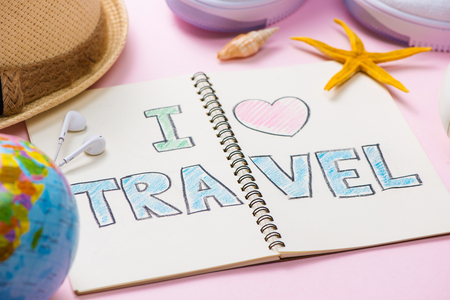 I love Travel written on pen notebook. Vacation Holiday Conceptの写真素材