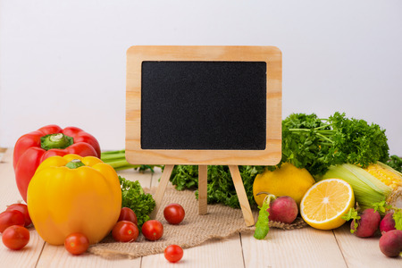 Fresh salad and blackboard for cooking recipes, free copy spaceの写真素材