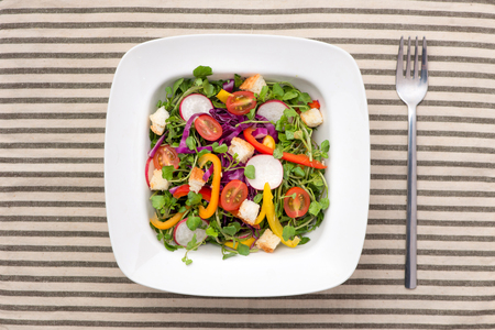 Homemade fresh green vegetable salad on table.の写真素材