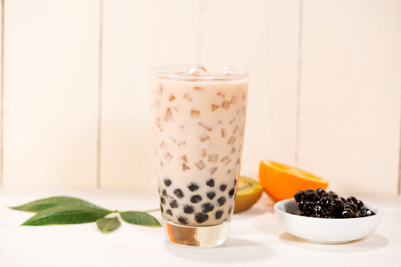 Boba / Bubble tea. Homemade Milk Tea with Pearls on wooden table.の写真素材
