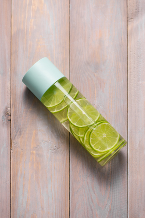 Detox Infused Water with Lime and Mint in Sports Bottle, with slices of lime.の写真素材