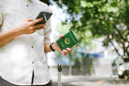 Man hands holding Vietnamese Passport. Ready for traveling.