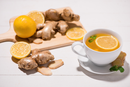 Healthy ginger tea ingredients on a wooden tableの写真素材