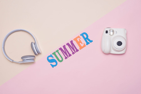 Summer fun written in colorful wooden letters on pastel color background.の写真素材