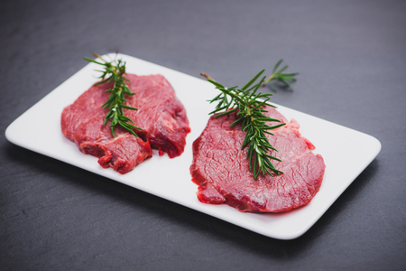 Raw beef meat sliced on a plateの写真素材