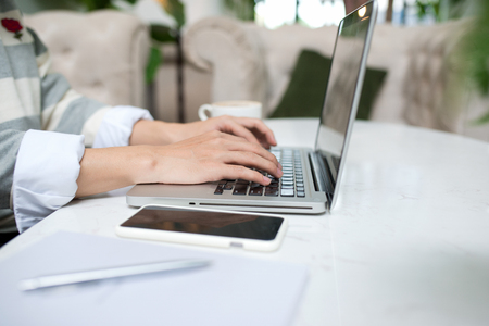 Asian young business man working with laptop atthe city cafe.の写真素材