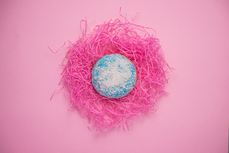 Donuts with icing on pastel pink background with copyspace. Sweet donuts.