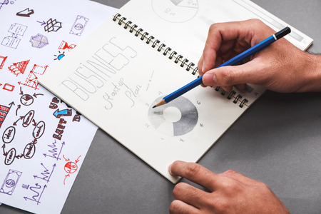 Business concept. Businessman writing idea sketchの写真素材