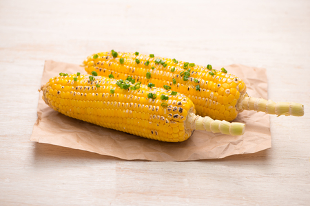 Tasty sweet grilled corn with onion sauceの写真素材
